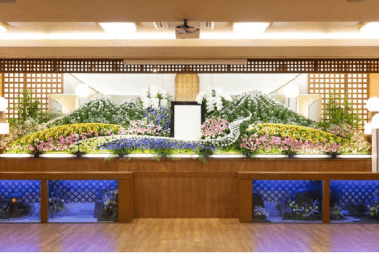 A large flower altar at a company representative's funeral.